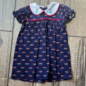 The Beaufort Bonnet Company navy dress with red heart detail.